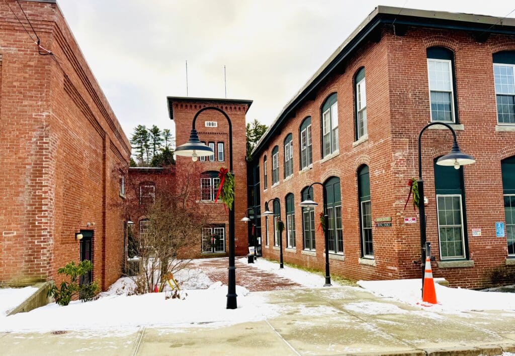 Brick building with snow on the ground.