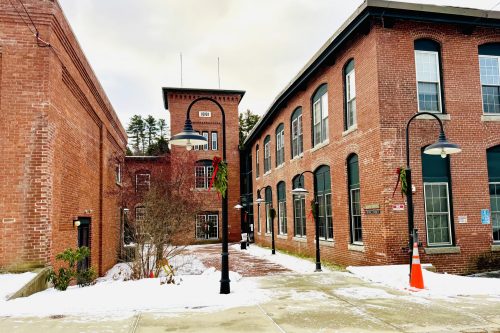 Brick building with snow on the ground.